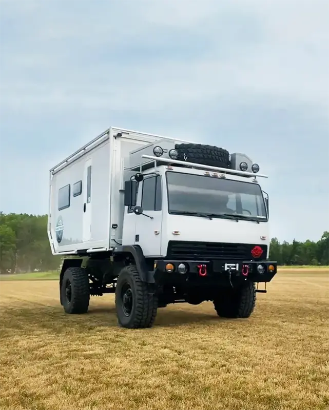 Expedition Departure Angle Camper in field.